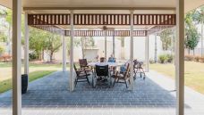 Bupa Aged Care Mount Sheridan outside courtyard with tables and chairs Feb 2021